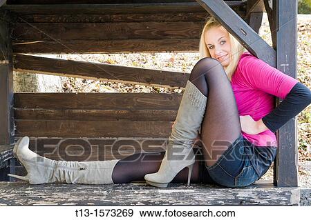 Attractive young woman in sexy high boots View Large Photo Image Stock Photo - Attractive young woman in sexy high boots. Fotosearch