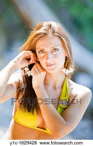 Stock Photo - Attractive young woman in swimsuit. Fotosearch