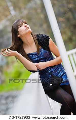 Attractive young woman is anxiously waiting View Large Photo Image Stock Image - Attractive young woman is anxiously waiting. Fotosearch