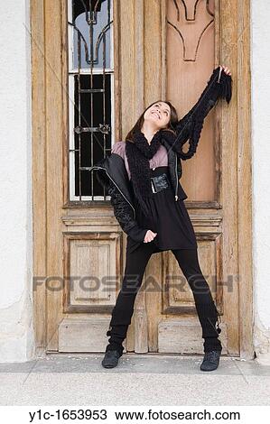 Stock Image - Attractive young woman is happy. Fotosearch