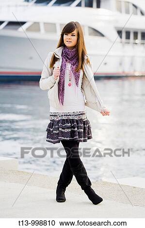 Attractive young woman is posing in harbour View Large Photo Image Stock Image - Attractive young woman is posing in harbour. Fotosearch