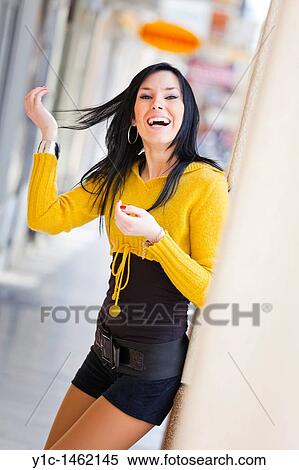 Attractive young woman is very happy, laughing View Large Photo Image Stock Photography - Attractive young woman is very happy, laughing. Fotosearch