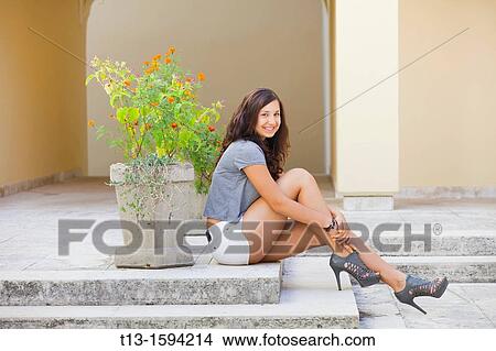 Attractive young woman is waiting View Large Photo Image Picture - Attractive young woman is waiting. Fotosearch