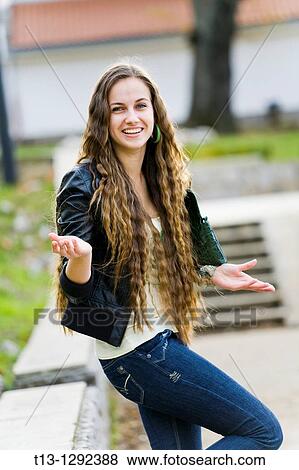 Attractive young woman is wondering View Large Photo Image Stock Photo - Attractive young woman is wondering. Fotosearch