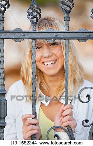 Picture - Attractive young woman laughing portrait. Fotosearch