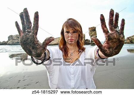 Attractive young Woman on the beach, with sand in her face and hands, El Sablon, Asturias, Spain View Large Photo Image Stock Photo - Attractive young Woman on the beach, with sand in her face and hands, El Sablon, Asturias, Spain. Fotosearch