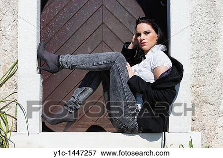 Attractive young woman on the doorstep View Large Photo Image Stock Photo - Attractive young woman on the doorstep. Fotosearch