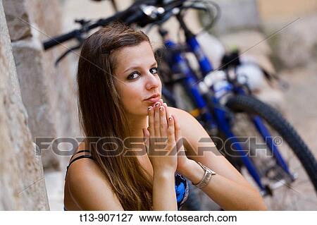 Stock Photo - Attractive young woman outdoors. Fotosearch