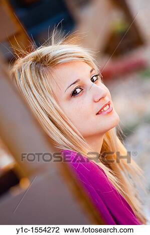 Stock Image - Attractive young woman portrait isolated. Fotosearch