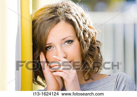 Attractive young woman portrait touching nose View Large Photo Image Picture - Attractive young woman portrait touching nose. Fotosearch