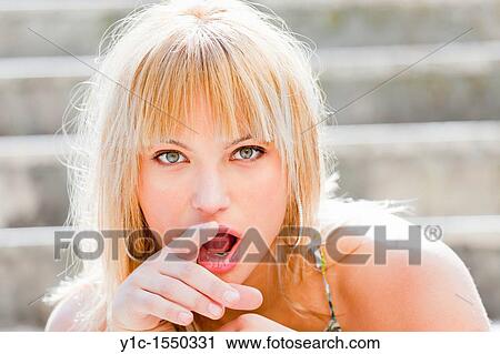 Stock Image - Attractive young woman portrait surprised. Fotosearch