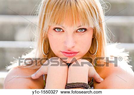 Attractive young woman portrait watchful and confident View Large Photo Image Stock Photo - Attractive young woman portrait watchful and confident. Fotosearch