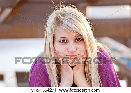 Stock Image - Attractive young woman sad portrait. Fotosearch