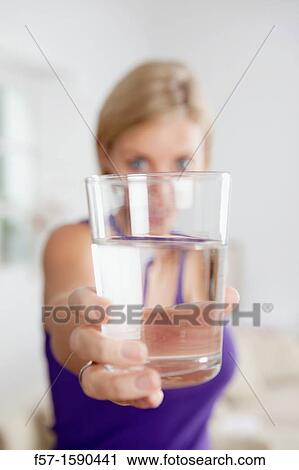 Attractive young woman with glass of water View Large Photo Image Stock Image - Attractive young woman with glass of water. Fotosearch