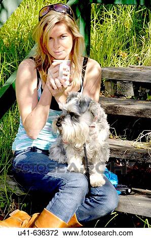 Attractive young women sitting on steps withcoffee cup and her dog View Large Photo Image Stock Image - Attractive young women sitting on steps withcoffee cup and her dog. Fotosearch