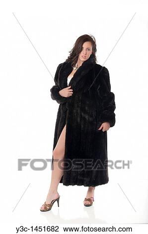 Stock Image - Attractve woman in mink coat. Fotosearch