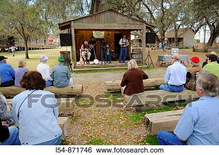Audience enjoys Pleasant Family Country Band Performs at Cracker Country Florida living history museum located on the Florida State Fairgrounds Tampa View Large Photo Image Stock Photograph - Audience enjoys Pleasant Family Country Band Performs at Cracker Country Florida living history museum located on the Florida State Fairgrounds Tampa. Fotosearch