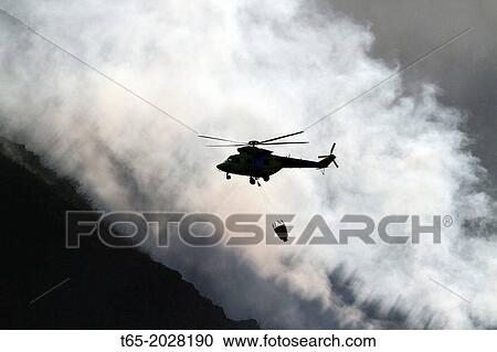 August 2013 Lugo Fire in Navia, in Ancares, Natura protected area, Biosphere and reserba. It affects more than 500 hectares of forest. Aerial and terrestrial media trying to control the fire from Thursday. View Large Photo Image Stock Image - August 2013 Lugo Fire in Navia, in Ancares, Natura protected area, Biosphere and reserba. It affects more than 500 hectares of forest. Aerial and terrestrial media trying to control the fire from Thursday.. Fotosearch