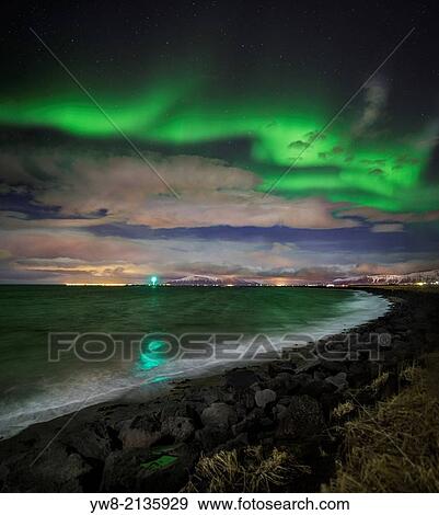 Stock Photo - Aurora Borealis or Northern Lights, Reykjavik, Iceland.. Fotosearch