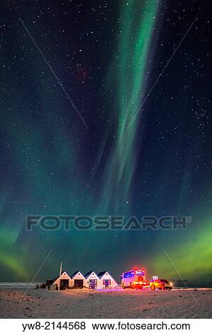 Stock Photo - Aurora Borealis or Northern lights. Cafe, tourist shop and tour bus at the, Jokulsarlon, Breidamerkurjokull, Vatnajokull Ice Cap, Iceland.. Fotosearch