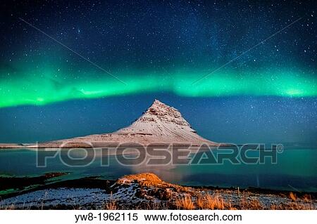 Aurora Borealis or Northern lights with the Milky Way Galaxy over fjord. Mt. Kirkjufell, Grundarfjordur, Snaefellsnes Peninsula, Iceland. View Large Photo Image Stock Photography - Aurora Borealis or Northern lights with the Milky Way Galaxy over fjord. Mt. Kirkjufell, Grundarfjordur, Snaefellsnes Peninsula, Iceland.. Fotosearch