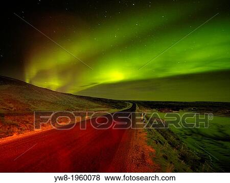 Aurora Borealis over empty road, Iceland. View Large Photo Image Stock Photo - Aurora Borealis over empty road, Iceland.. Fotosearch