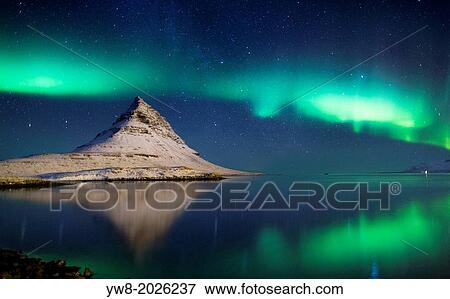 Aurora borealis with Mt. Kirkjufell in Grundarfjordur on Snaefellsnes Peninsula, Iceland. View Large Photo Image Stock Photo - Aurora borealis with Mt. Kirkjufell in Grundarfjordur on Snaefellsnes Peninsula, Iceland.. Fotosearch