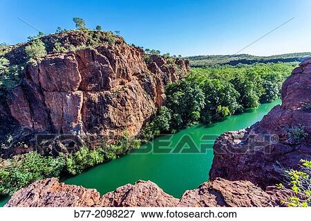Australia, northwestern Queensland, Upper Gorge Track at Boojamulla (Lawn Hill) National Park, Duwadarri Lookout, view of a prominent cliff face at Middle Gorge. View Large Photo Image Stock Photo - Australia, northwestern Queensland, Upper Gorge Track at Boojamulla (Lawn Hill) National Park, Duwadarri Lookout, view of a prominent cliff face at Middle Gorge.. Fotosearch