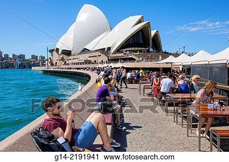Australia, NSW, New South Wales, Sydney, Sydney Harbour, harbor, East Circular Quay, Sydney Opera House, promenade, Opera Bar, restaurant, alfresco dining, tables, umbrellas, water. View Large Photo Image Stock Image - Australia, NSW, New South Wales, Sydney, Sydney Harbour, harbor, East Circular Quay, Sydney Opera House, promenade, Opera Bar, restaurant, alfresco dining, tables, umbrellas, water.. Fotosearch