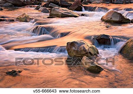 Autumn colors reflecting in tumbling waterfalls in Virgin River in Zion National Park, Utah, USA View Large Photo Image Stock Image - Autumn colors reflecting in tumbling waterfalls in Virgin River in Zion National Park, Utah, USA. Fotosearch