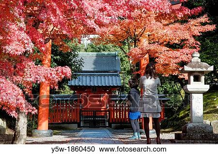 Autumn fall colours surround a Shinto shrine outside Tenryu-ji Temple, Kyoto, Japan View Large Photo Image Stock Image - Autumn fall colours surround a Shinto shrine outside Tenryu-ji Temple, Kyoto, Japan. Fotosearch