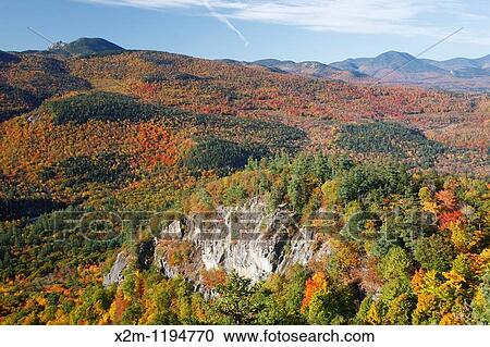 Autumn foliage from the Boulder Loop Trail This trail is located along the Kancamagus Highway route 112, which is one of New England's scenic byways in the White Mountains, New Hampshire USA Mount Chocorua is in the distance View Large Photo Image Stock Image - Autumn foliage from the Boulder Loop Trail This trail is located along the Kancamagus Highway route 112, which is one of New England's scenic byways in the White Mountains, New Hampshire USA Mount Chocorua is in the distance. Fotosearch