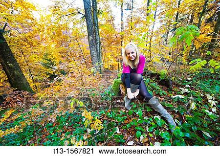 Autumn forest colors and a young woman View Large Photo Image Stock Image - Autumn forest colors and a young woman. Fotosearch