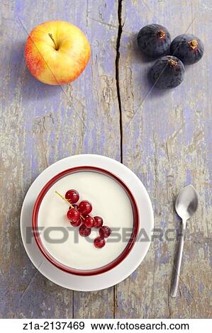Stock Photo - Autumn fruit still life on a violet wooden table.. Fotosearch