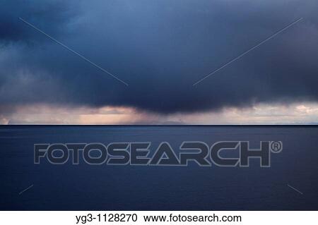 Stock Image - Autumn storm clouds over Vestfjord, Lofoten islands, Norway. Fotosearch