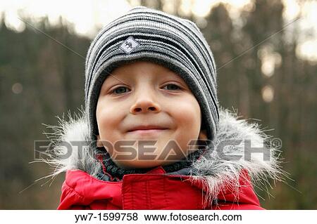 Autumnal portrait of a five year old boy View Large Photo Image Stock Photo - Autumnal portrait of a five year old boy. Fotosearch