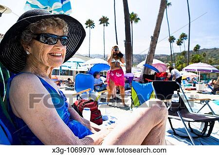 Stock Image - Avalon is a place where families often spend vacation time. Families often gather in large groups on the beach and enjoy each others company.. Fotosearch