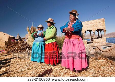 Aymara women singing songs for welcoming tourists, Uros Islands, Lake Titicaca, Puno Region, Peru, South America. View Large Photo Image Stock Photograph - Aymara women singing songs for welcoming tourists, Uros Islands, Lake Titicaca, Puno Region, Peru, South America.. Fotosearch