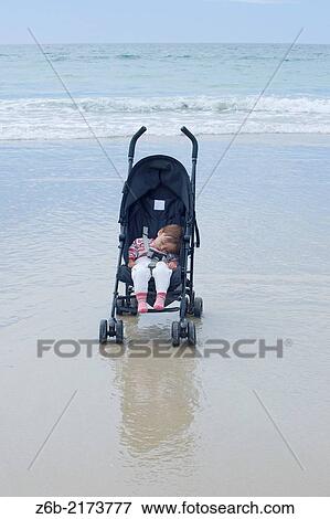 Baby, 11 Months, Corrubedo Beach, Atlantic Ocean, Galicia, Spain, Sleeping, Baby Carriage, Alone, Risk View Large Photo Image Stock Photo - Baby, 11 Months, Corrubedo Beach, Atlantic Ocean, Galicia, Spain, Sleeping, Baby Carriage, Alone, Risk. Fotosearch