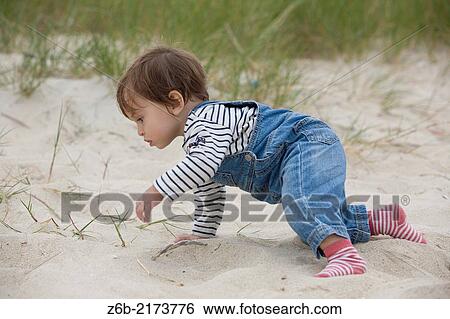 Baby, 11 Months, Crawl, Spain, Galicia, Corrubedo, Curious, Outdoors, beach, Toddler View Large Photo Image Stock Photograph - Baby, 11 Months, Crawl, Spain, Galicia, Corrubedo, Curious, Outdoors, beach, Toddler. Fotosearch