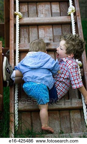 Baby and brother on ladder View Large Photo Image Stock Photograph - Baby and brother on ladder. Fotosearch