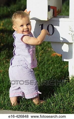 Baby at mailbox. View Large Photo Image Stock Photo - Baby at mailbox.. Fotosearch