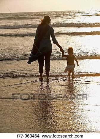 Picture - Baby at seashore with her Mother. Fotosearch