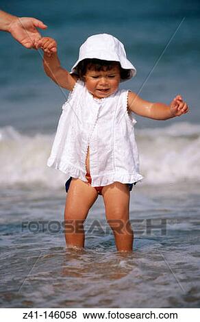 Stock Photo - Baby at the beach. Fotosearch