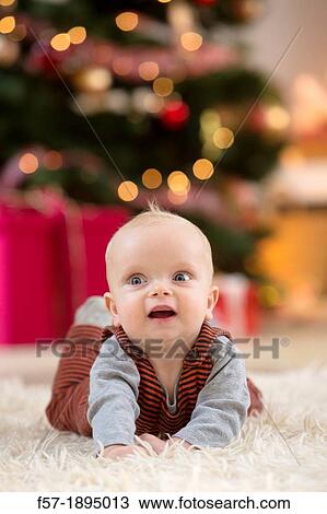 Stock Image - Baby boy at Christmas. Fotosearch