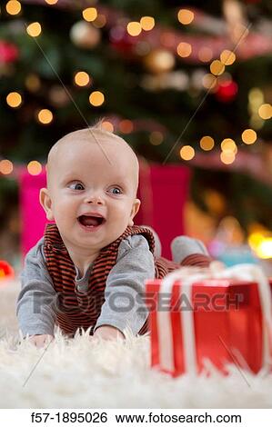 Baby boy at Christmas View Large Photo Image Stock Photograph - Baby boy at Christmas. Fotosearch