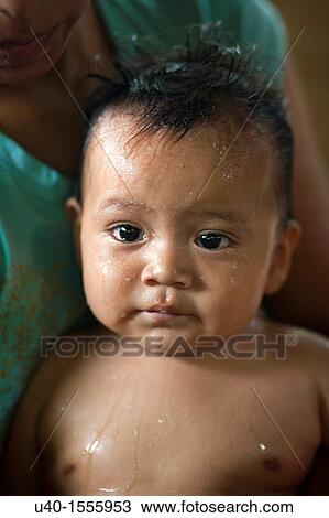 Baby boy being bathed View Large Photo Image Stock Image - Baby boy being bathed. Fotosearch