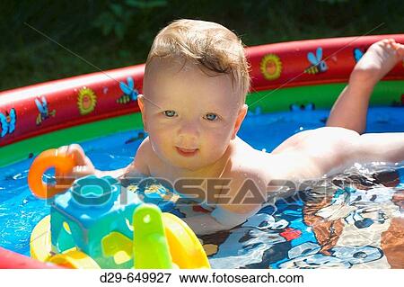 BABY BOY IN POOL. View Large Photo Image Stock Photo - BABY BOY IN POOL.. Fotosearch