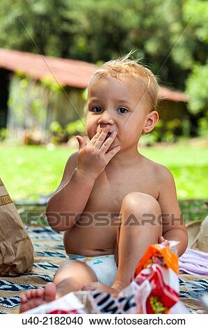 baby boy playing at a picnic. View Large Photo Image Stock Image - baby boy playing at a picnic.. Fotosearch