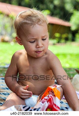 baby boy playing at a picnic. View Large Photo Image Stock Photo - baby boy playing at a picnic.. Fotosearch